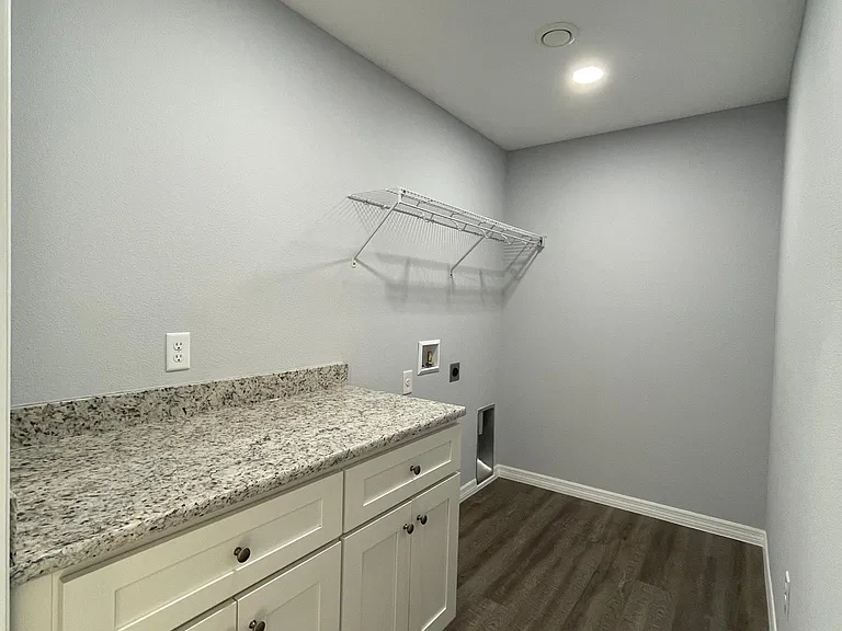 Spacious laundry room with hookups