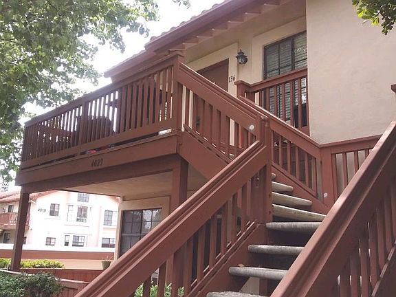 Stairs up to the condo with balcony outside condo
