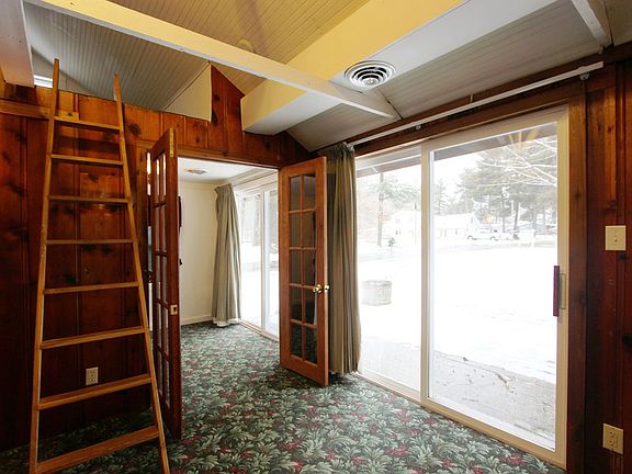Double Patio Doors Leading to Large Wood Deck, New Roof & Siding