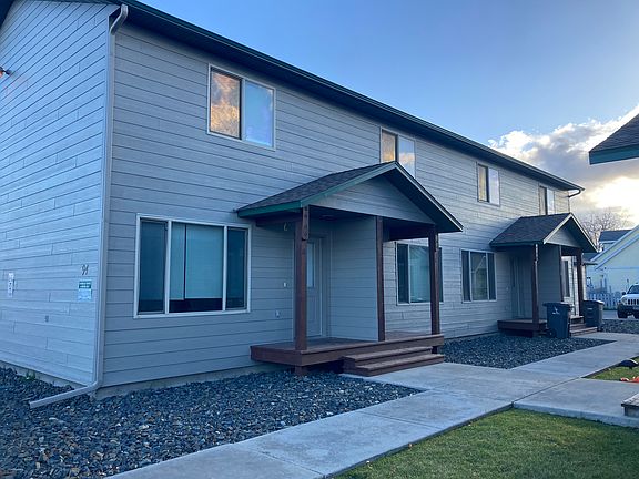 Front of building. Front entry has covered porch