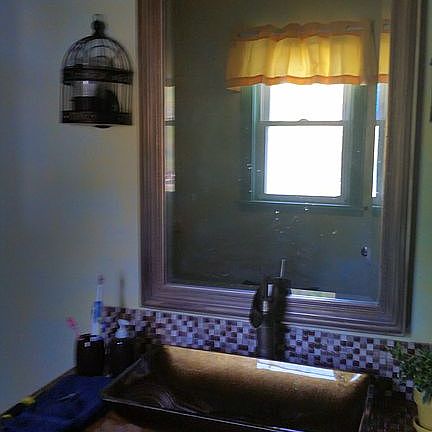 Antique mirror over vanity