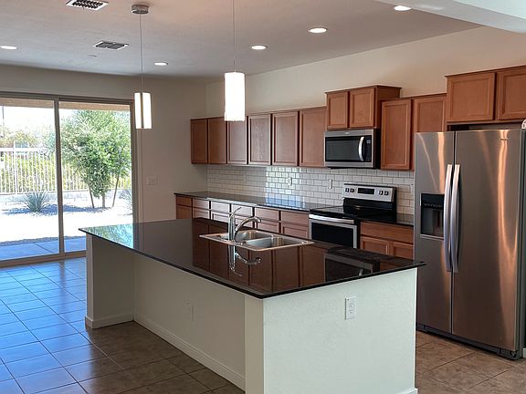 Kitchen with plenty of cabinet space and stainless appliances.