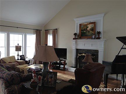 Great room with 16' soaring ceilings with gas FP