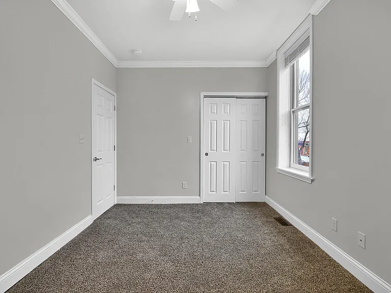 Bedroom 2 - level 2: 10' ceilings, large closet, ceiling fan, crown moulding