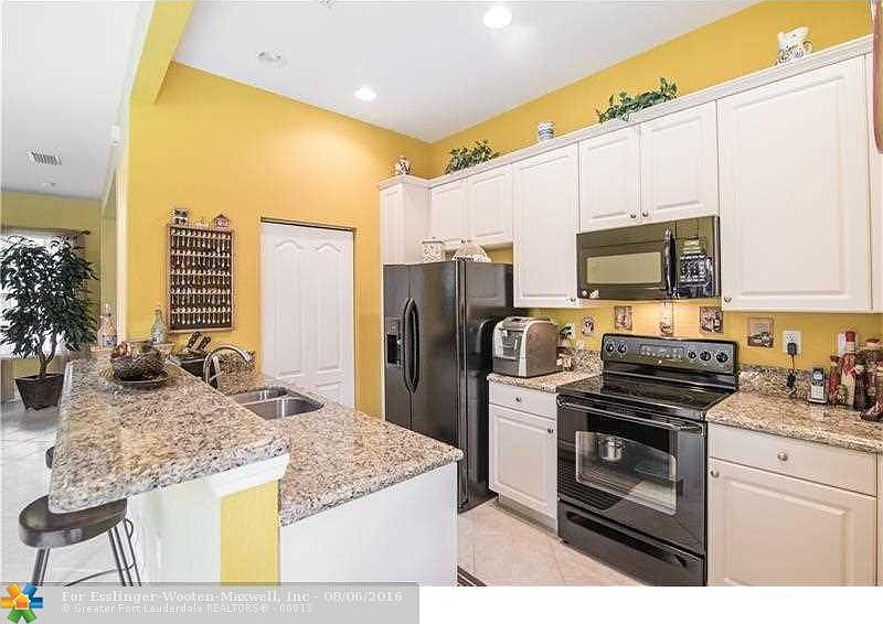 Mediterranean Inspired West Pembroke Pines Charmer - Cobblestone Town Home