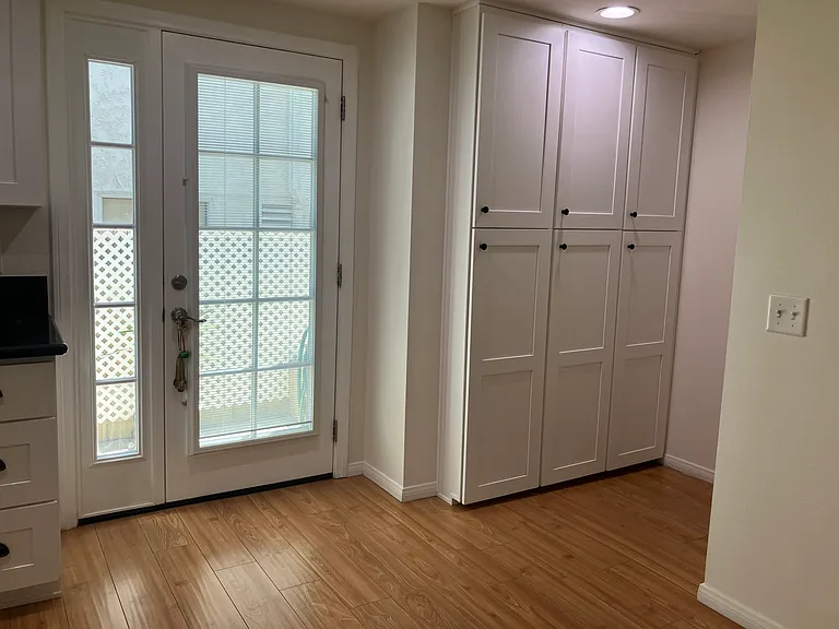 Cute half bathroom hidden under the stairs and adjacent to the pantry