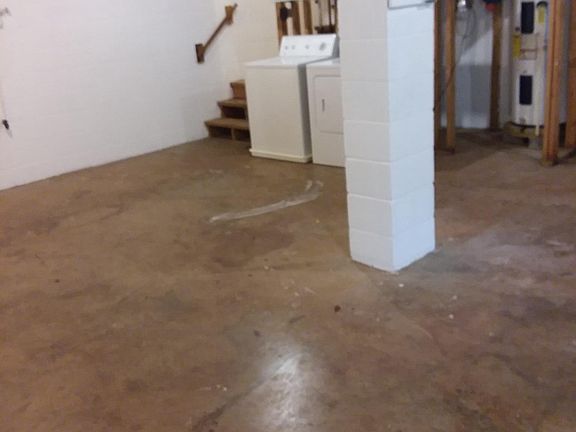 Full unfinished basement with washer and dryer 