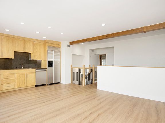 Refrigerator, dishwasher and sink in the bonus/media room