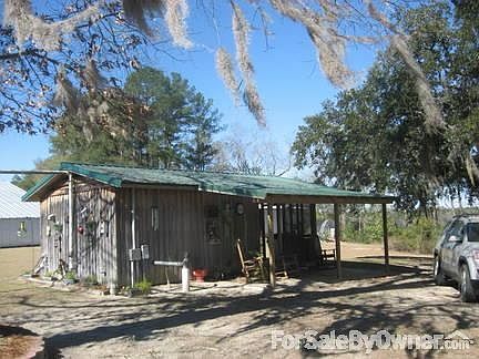 Pumphouse with covered porch