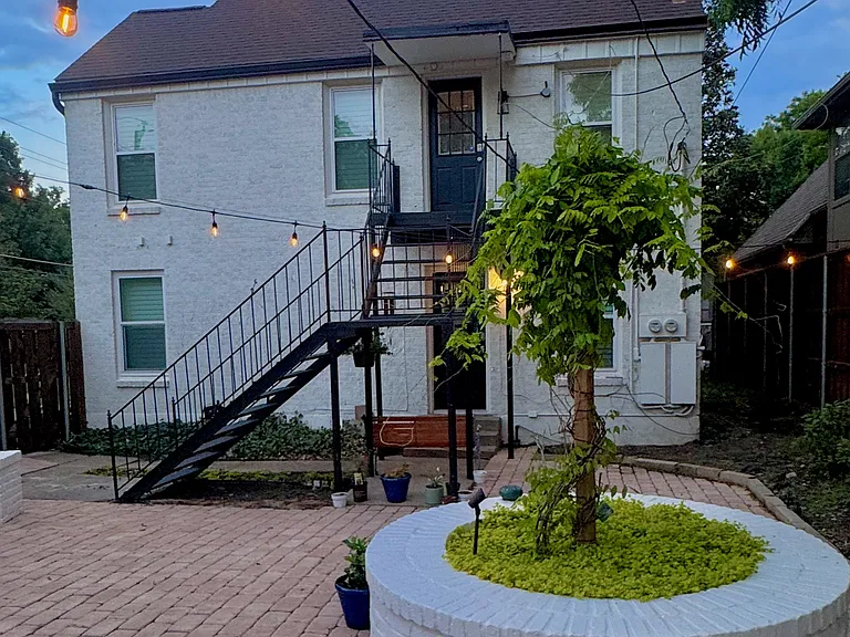 View from the gorgeous backyard courtyard looking over at the duplex unit.