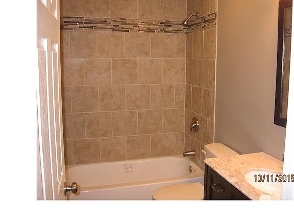 The "motel effect". Elegant yet sophisticated main bath features ceramic tile shower and...???...yep...floors too!
