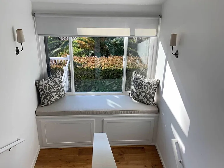 staircase with bench to sit and enjoy a book and view