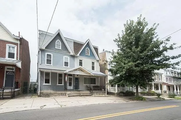 My house, on the right, cream with blue, and there is the bus stop to center city to the left just out of view