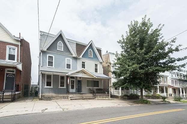 My house, on the right, cream with blue, and there is the bus stop to center city to the left just out of view