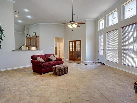 Family room is open to the large kitchen, adjacent to the study and has a door out to the back yard and pool