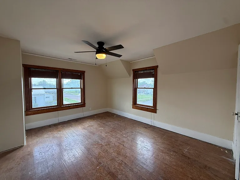 BR3 - upstairs. Hardwood floors are being refinished.