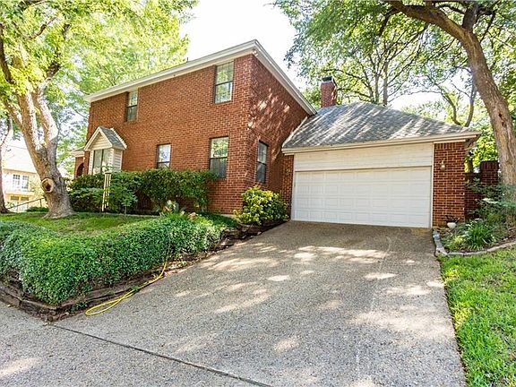 The home is located on a corner lot with a side entry driveway and a  two car garage.