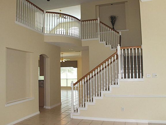 View upon entry of pretty staircase. Many art niches throughout the house.
