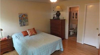 Master bedroom is spacious.  Bed placement has 3 different wall