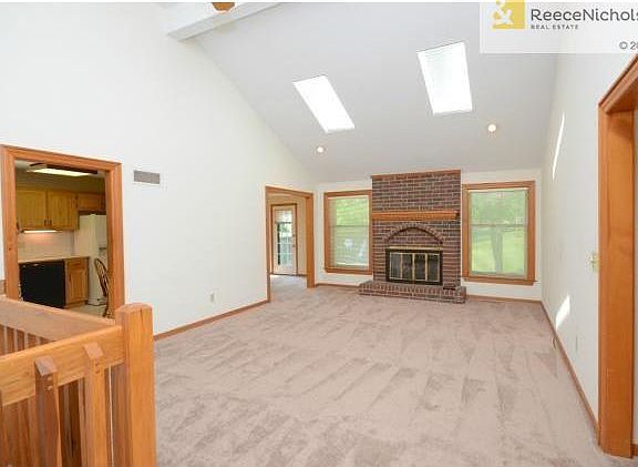Great room features brick fireplace