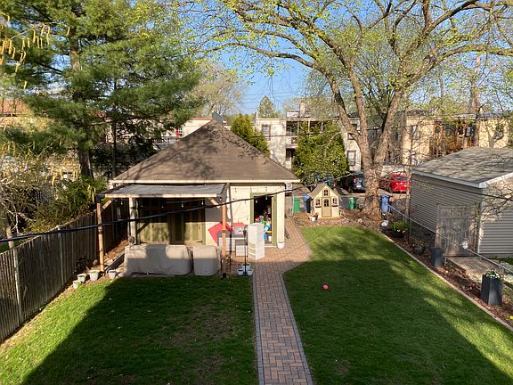 Backyard with 2-car garage. Shed not pictured.