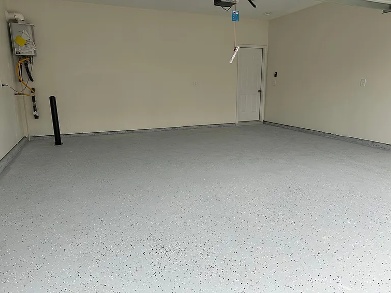 Fully finished garage with epoxy floor for easy maintenance