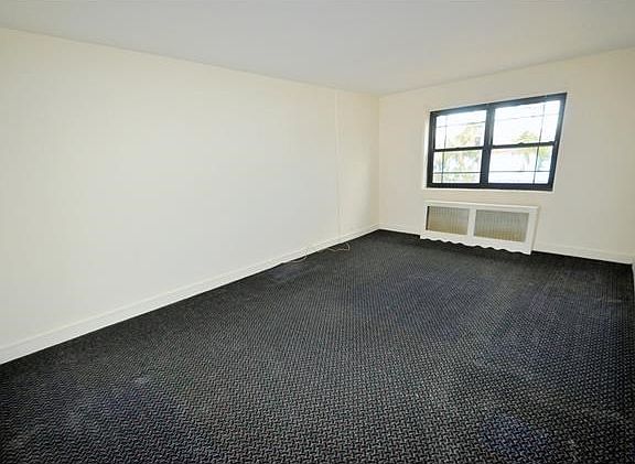 Large living room with covered hardwood floors and Picturesque views of Lake Isle.