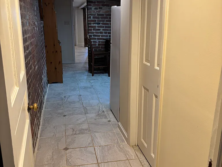 View from bedroom to bath and hall.