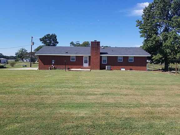 Back of house with yard