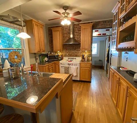 Stove in this picture has been replaced with modern stainless stove.