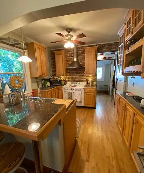 Stove in this picture has been replaced with modern stainless stove.
