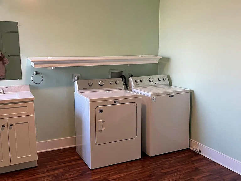 Downstairs laundry room in the large downstairs bathroom
