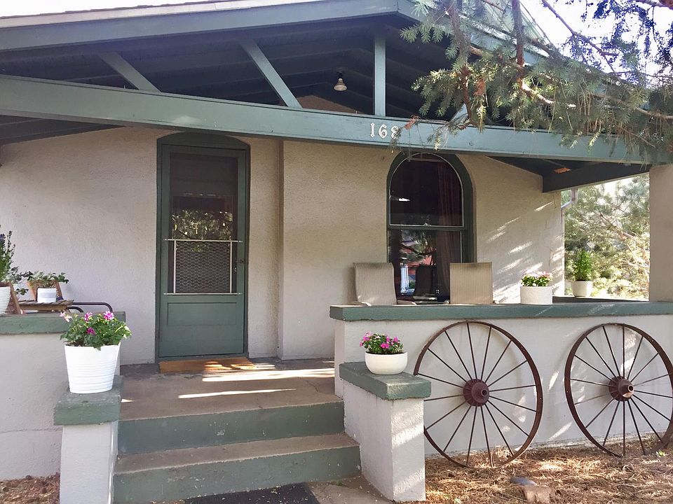 front of house with large shaded front porch