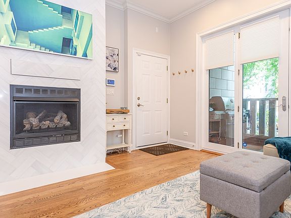 Fireplace with quartz tile surround, drawer for remotes and wiring for TV.