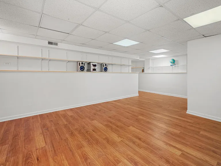 Finished basement with lots of shelves