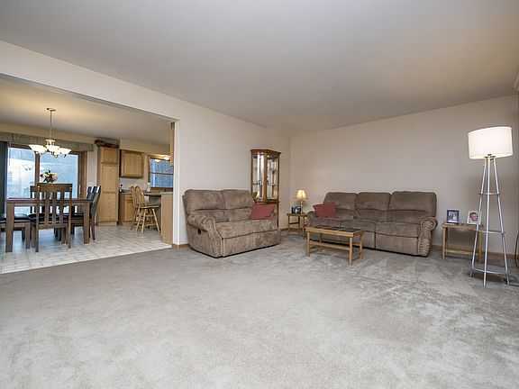 Living room (14x19) welcomes you right in with neutral paint and clean carpet.