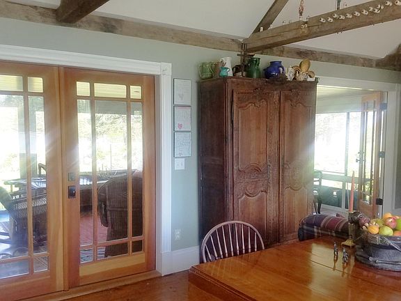 We installed a double set of French doors that open to a screened porch to enjoy views from both sides of the home.