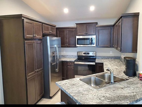 Kitchen, stainless steel appliances including dishwasher lots of cabinet space.