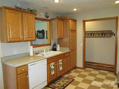 Kitchen with "cut out" overlooking the Living Room