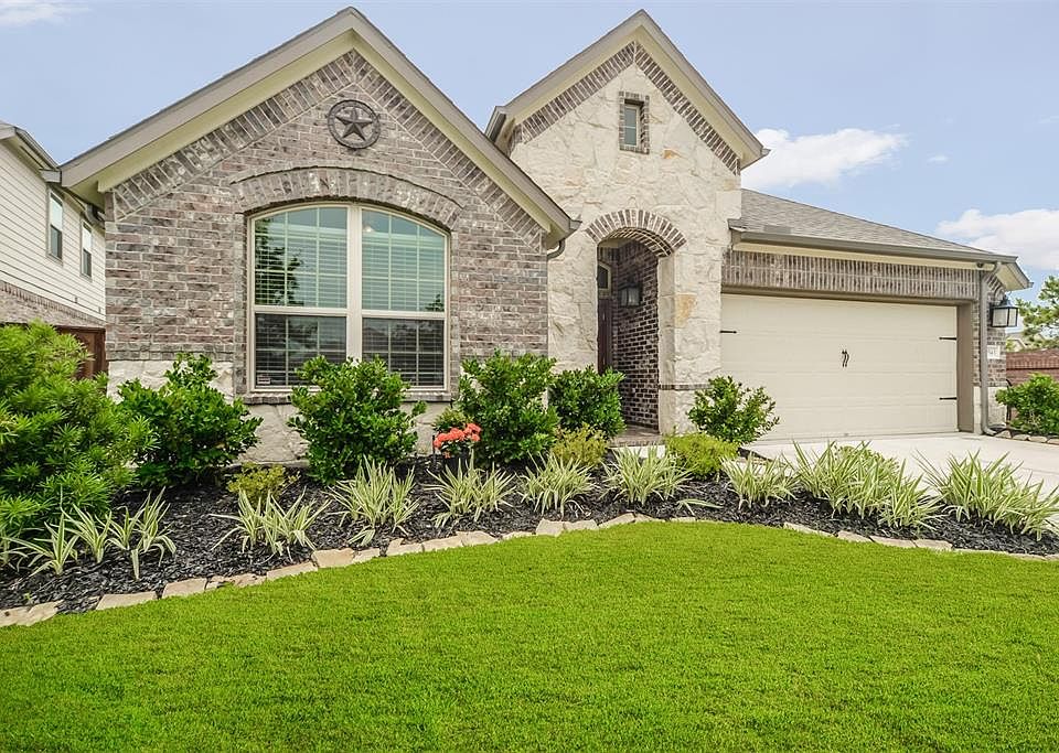 Great curb appeal! This home has been beautifully landscaping and has extra room to park within the cul de sac.