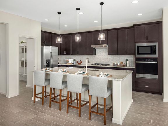 Kitchen in the Mesquite floorplan at Arbor at Madera Highlands.