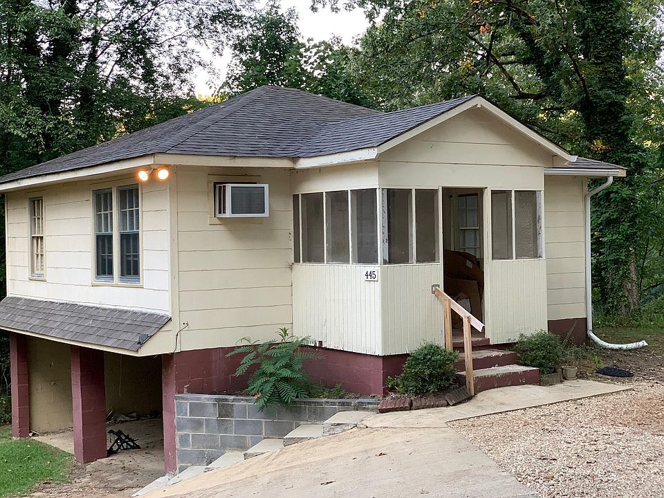 Front entry with covered parking underneath.