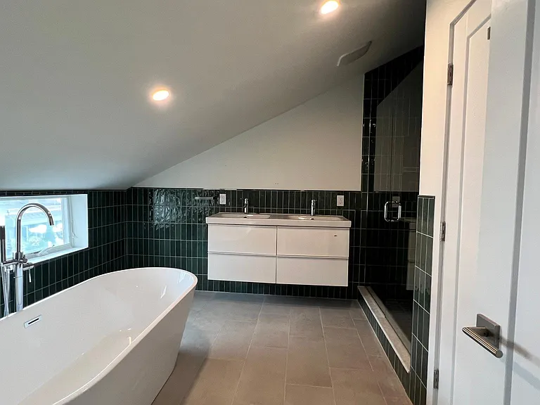 Deluxe Bath with soaking tub, walk in shower, double vanity and water closet.