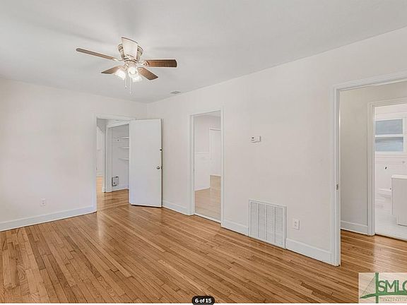 Dining room with hardwood floors and natural sunlight.