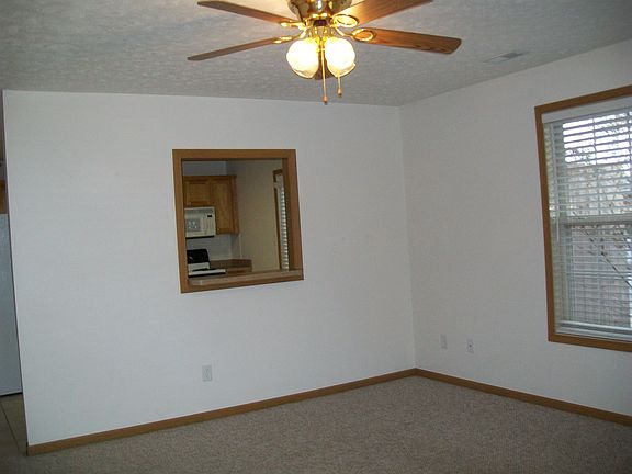living room with opening to kitchen