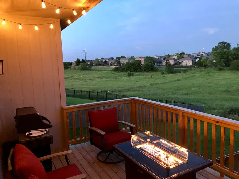 Deck firetable, chairs, and grill