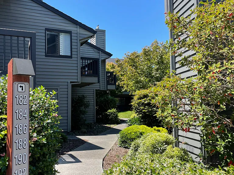 Complex has well-maintained landscaping and meandering paths