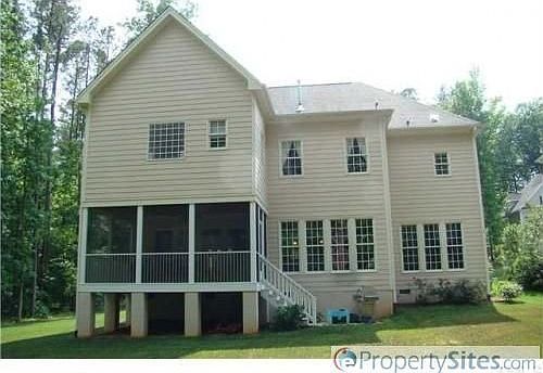 Rear of the home with large screened porch