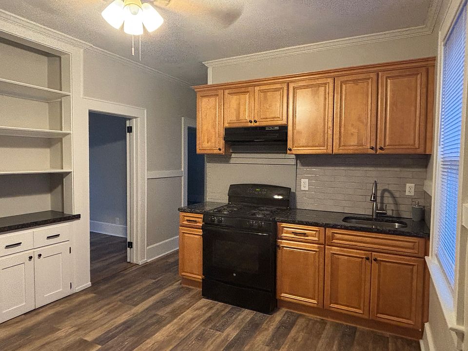 Kitchen view with 2nd middle bedroom doorway on the left.