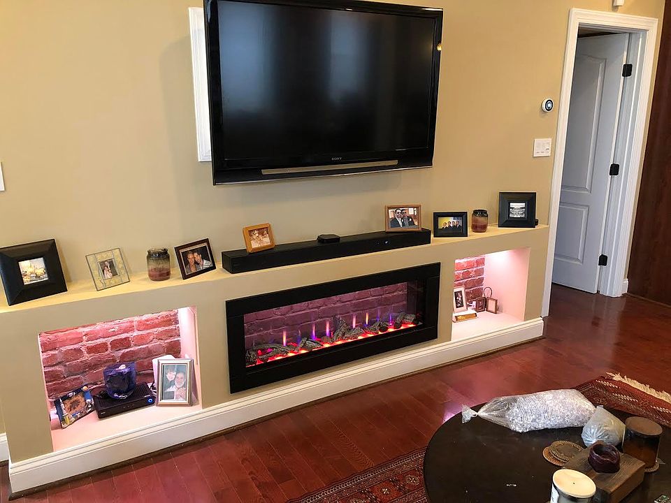 Electric fireplace and Large flat screen TV.